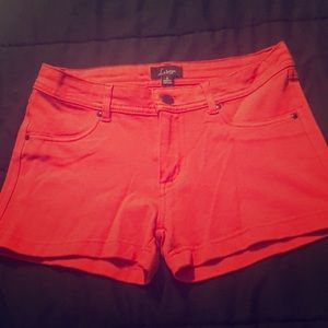 Coral form fitting shorts